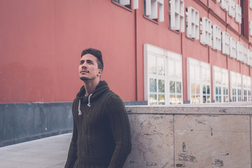 Young  man posing in an urban context