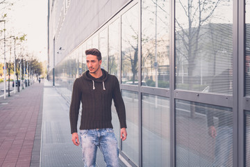 Young  man posing in an urban context