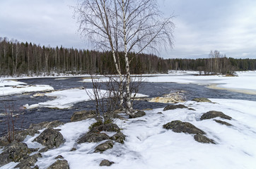 Rapids on Shuya river in winter. Karelia, Russia.