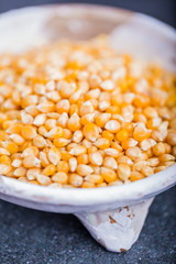 Dry grain corn in a white bowl