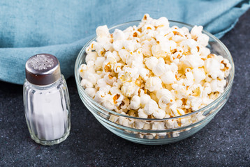 Glass bowl full of popcorn