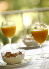 Blurry romantic breakfast,cereals with orange juice
