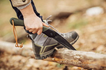 girl holding a saw and sawing