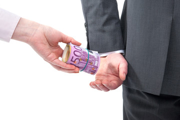 Businessman in a suit takes a bribe