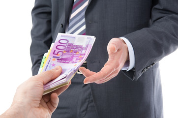 Businessman in a suit takes a bribe