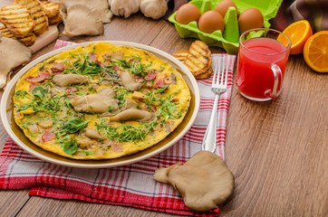 Omelette with smoked meat and mushrooms