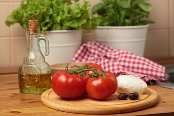 Tomatoes and mozzarella on a kitchen table