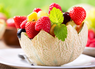 fruit salad in a half of melon