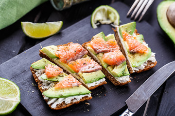 Sandwich with avocado and smoked salmon - 82263723