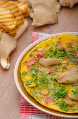 Omelette with smoked meat and mushrooms