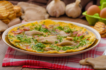 Omelette with smoked meat and mushrooms