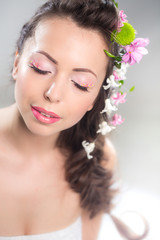 Naklejka premium Woman with flowers in hair