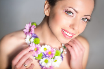 Fototapeta na wymiar Woman with flower necklace