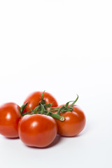 A bunch of a fresh and juicy tomatoes isolated