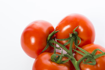 A bunch of a fresh and juicy tomatoes isolated
