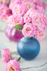 Obraz na płótnie Canvas Beautiful fresh roses on a table.