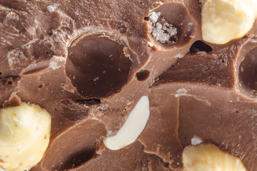 Chocolate with nuts close up background concept