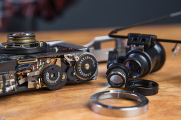 Handsome young girl with broken vintage film camera