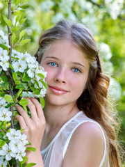 Beautiful girl with flowering tree.