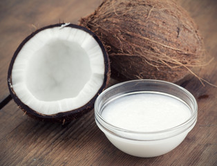 Coconuts and organic coconut oil in a glass jar