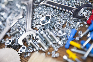 Fototapeta premium Assorted work tools on wood background