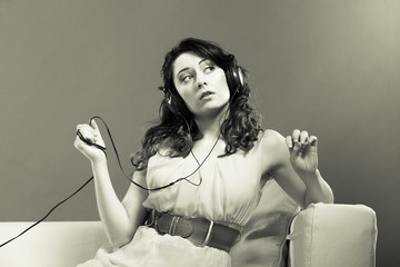 girl in big headphones listening music mp3 relaxing