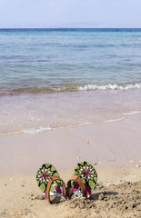 Fototapeta na wymiar sea and beach slippers