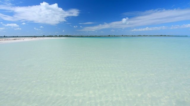 Wide angle sparkling clear water of shallow paradise lagoon
