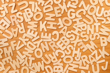 Surface covered with multiple wooden letters