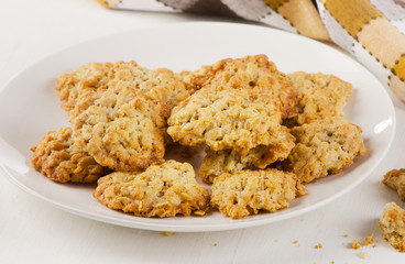 Freshly baked oatmeal cookies on a plate.
