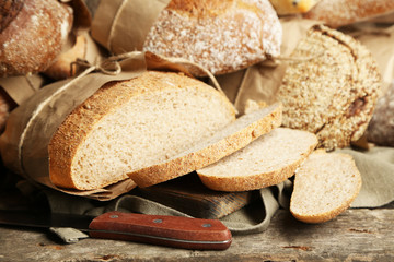 Different fresh bread, on old wooden table