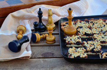 Plum pie and chess on the garden bench