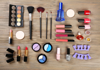 Various cosmetics on wooden background