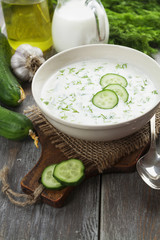 Summer soup with cucumbers, yogurt and fresh herbs