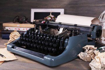 Retro typewriter on wooden background