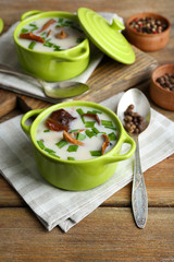 Mushroom soup on wooden background