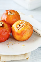 Baked apple on a white plate