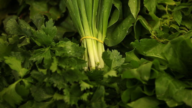 Vegetables in market. Slide. Green Onion.