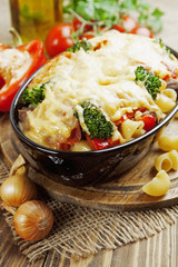 Casserole with meat, pasta, broccoli and tomatoes