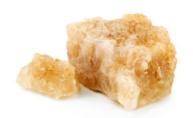 Crust of sea salt from Dead Sea coast isolated on white