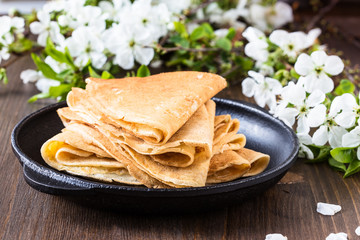 Crepes  folded in triangles on frying pan