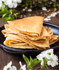 Crepes  folded in triangles on frying pan