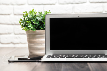 Fototapeta premium Open laptop on a wooden desk