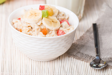 Oatmeal with candied fruils and milk