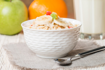 Oatmeal with candied fruils and milk