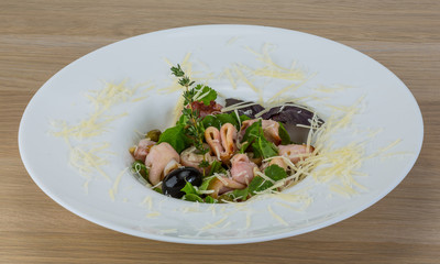 Rucola with squid salad