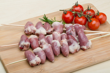 Raw chicken hearts for barbecue