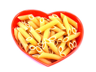 macaroni italian pasta close up in heart bowl