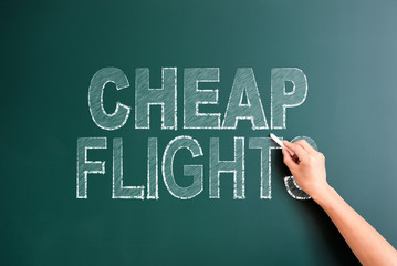 writing cheap flight on blackboard