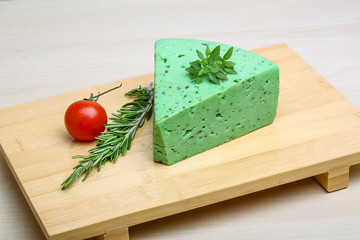 Green pesto cheese and basil leaves